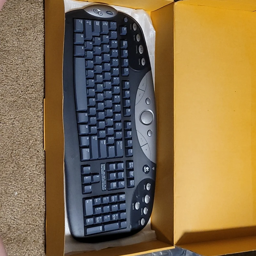 Logitech cordless freedom optical - cordless keyboard and optical mouse